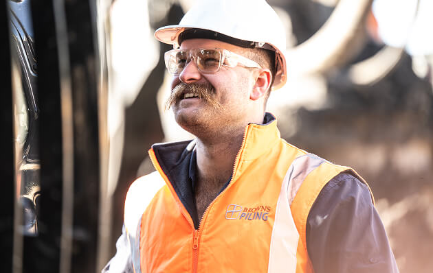 A man in a hard hat smiling